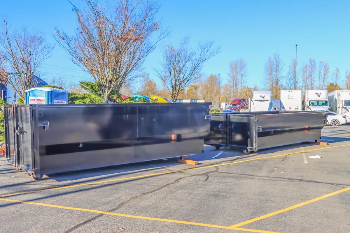 Professional dumpster rental service with roll-off container on residential driveway in Sutherlin