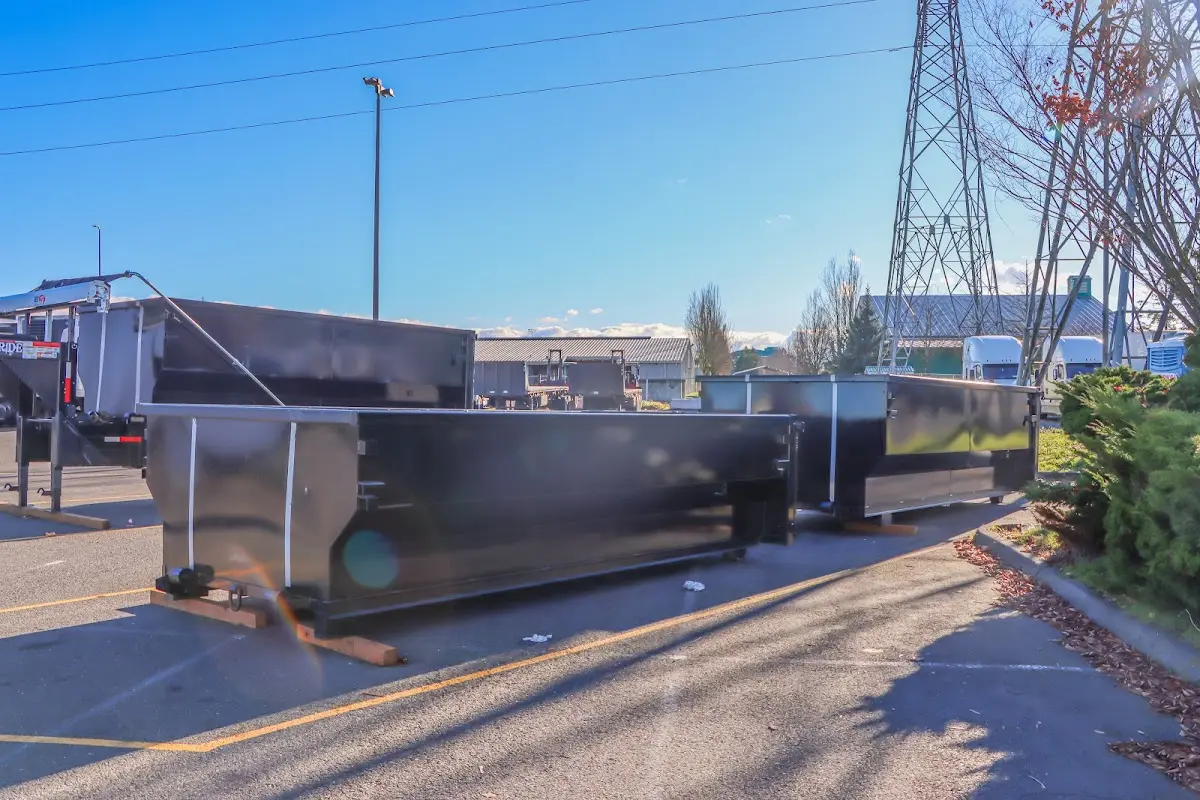 Roll-off dumpster ready for waste disposal at job site for Construction Dumpster Rental in Sutherlin